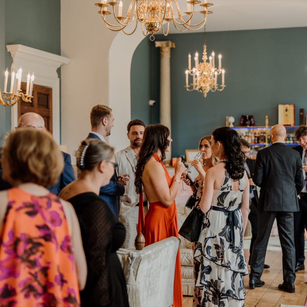 People having a drink in the bar at Kings Weston House.