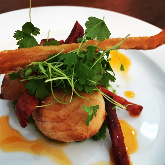 A la carte cuisine on a white dinner plate
